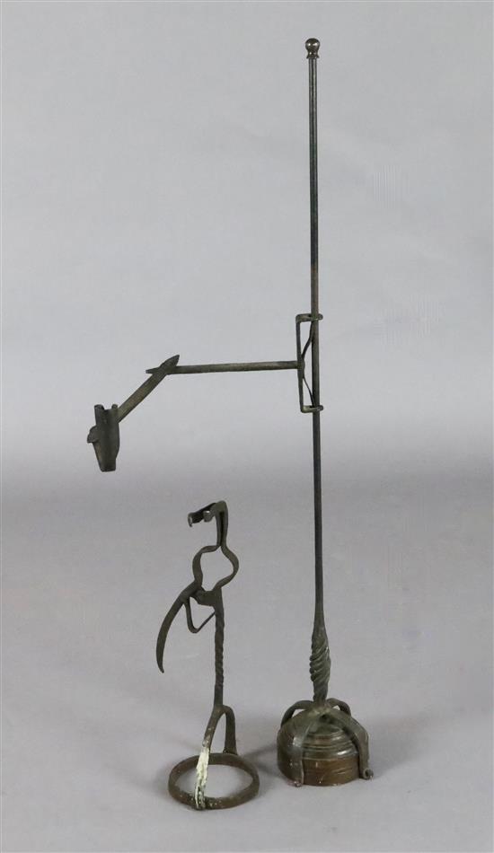 A 17th century wrought iron rushlight holder, height 17.5in.
